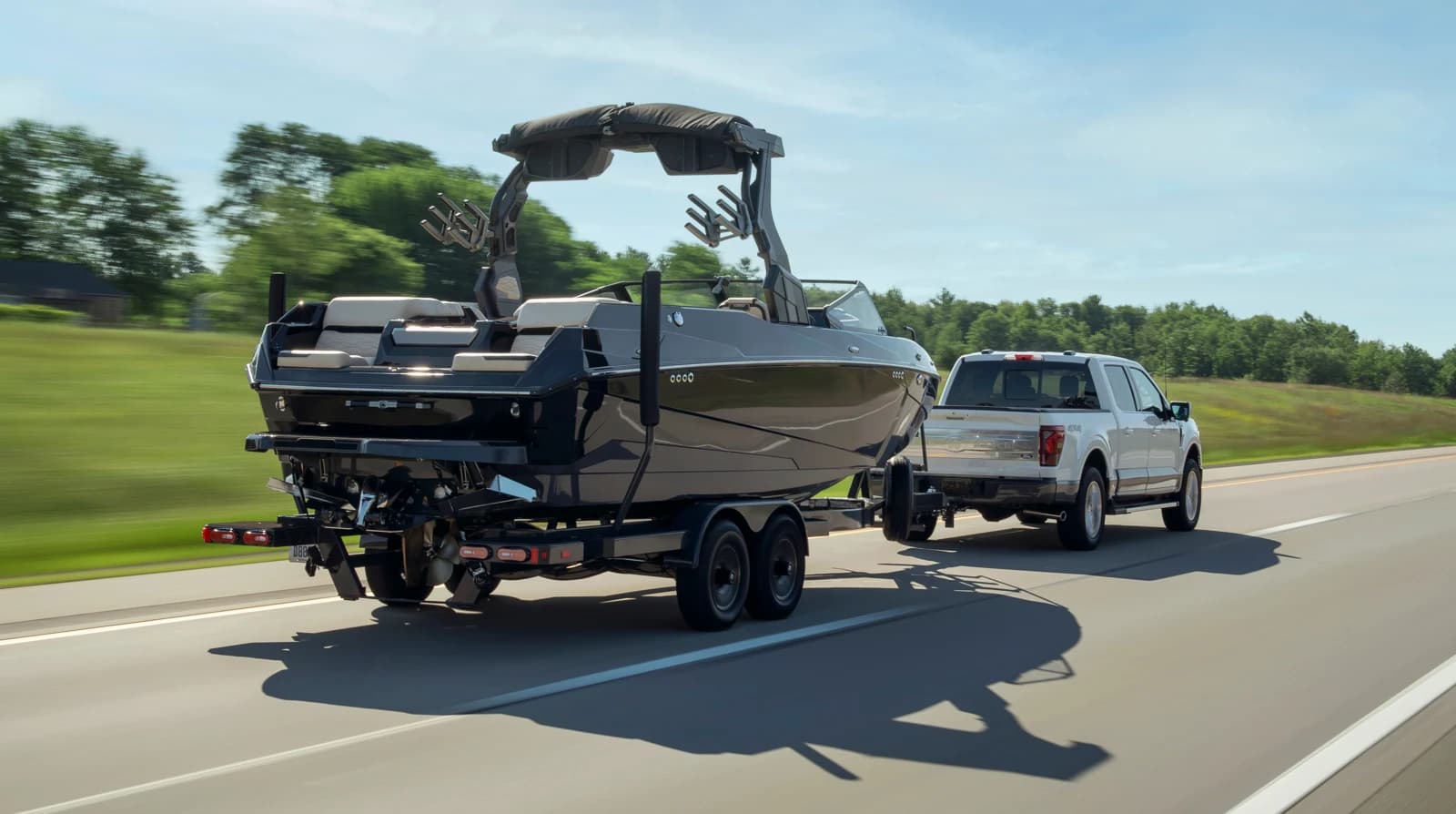 2027 Ford F-150 King Ranch towing on a highway